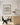 Modern kitchen with a framed poster on the wall reading 'More Espresso Less Depresso'.
