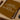 Framed brown print with 'More Espresso Less Depresso' text on a wooden surface