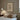 Framed 'This is our happy place' artwork on a wall above a bed with decorative pillows.